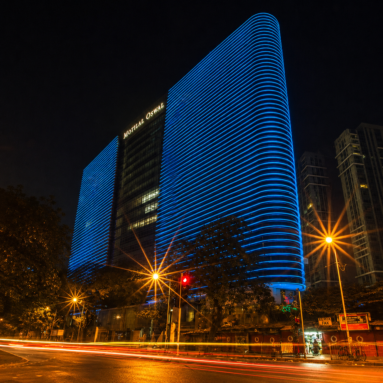 Motilal Oswal Tower in Mumbai illuminated in blue at night